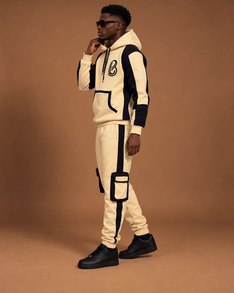 The Ivory Shadow Set — ivory hoodie and cargo joggers with black panels, side view